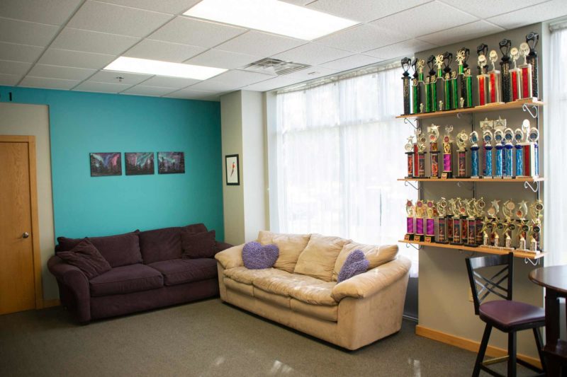Ultimate Leap Dance Center Waiting Area with sofa and trophies